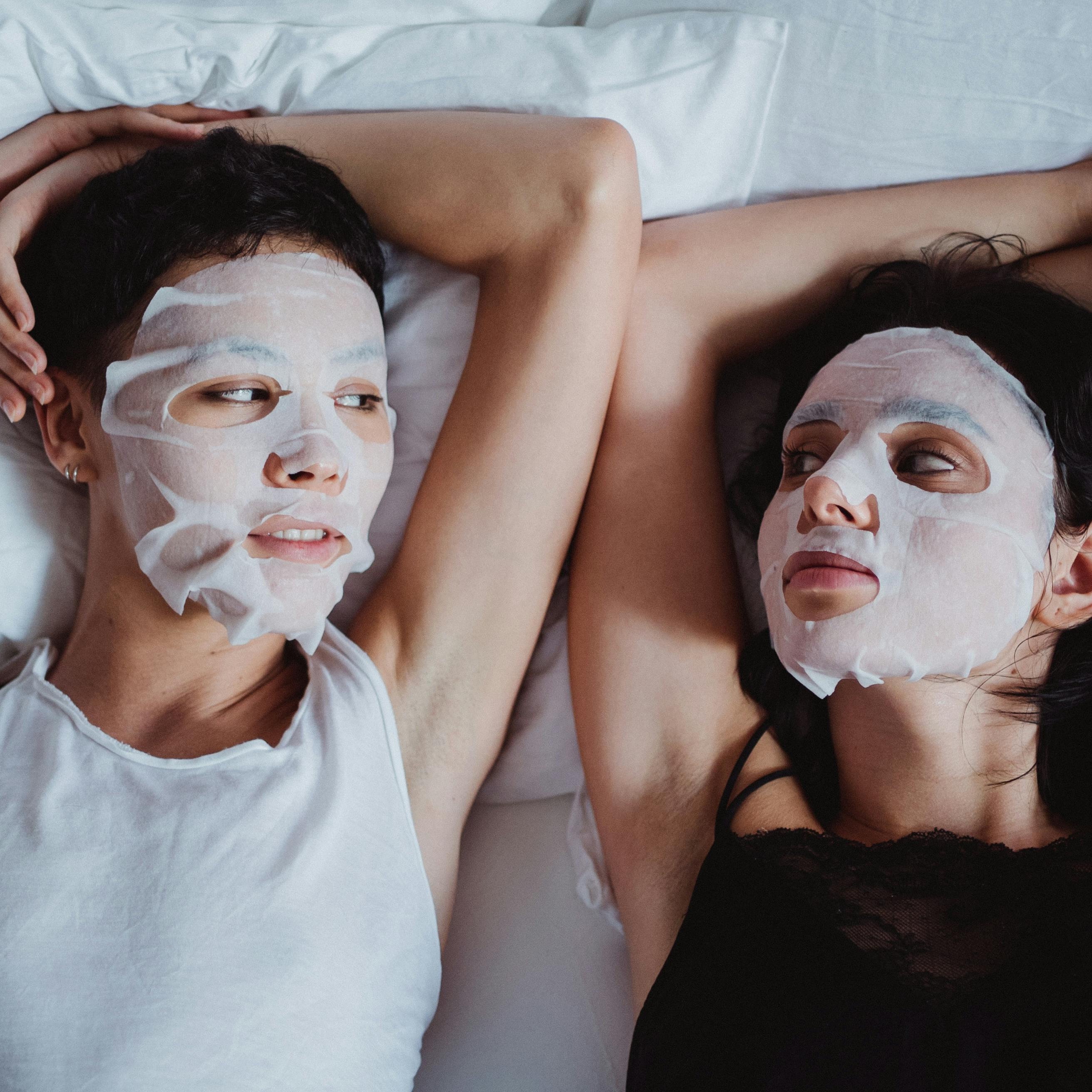 Couple wearing Hydrate and Glow Bamboo Sheet Masks together — at-home hydrating skincare ritual