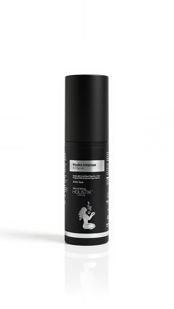 Black cylindrical serum bottle with white and silver label on a white background