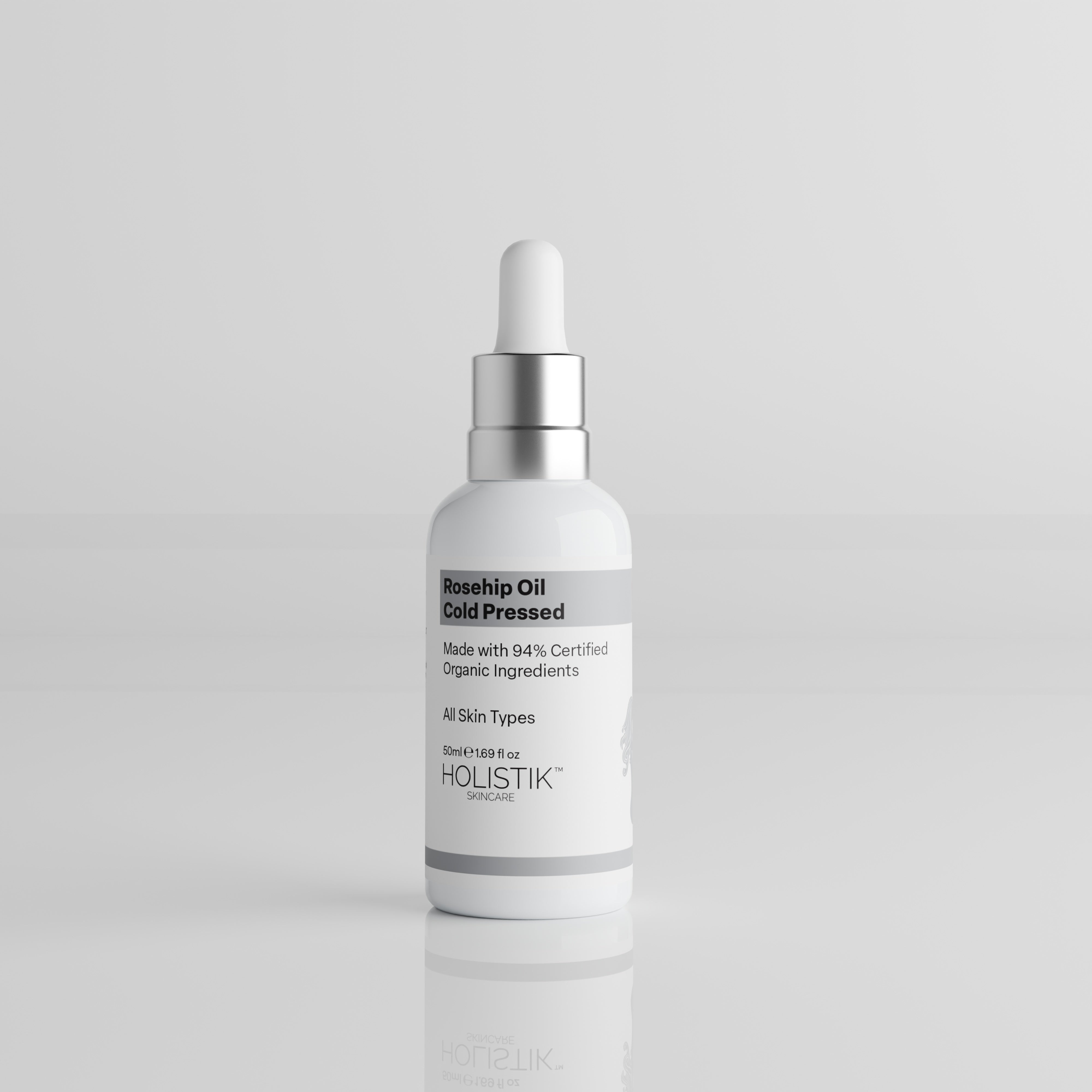 White Skincare Dropper Bottle labelled Rosehip Oil by Holistik Skincare on white background
