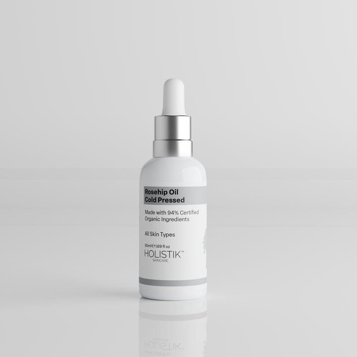 White Skincare Dropper Bottle labelled Rosehip Oil by Holistik Skincare on white background