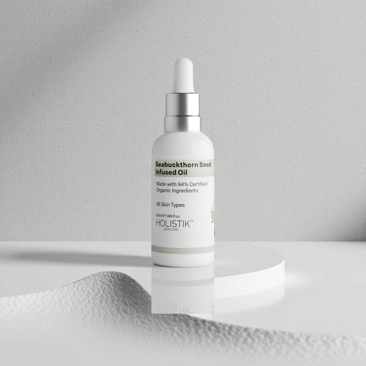 Skincare bottle on a textured white surface with white background