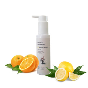 Vitamin C gel cleanser bottle with oranges and lemons on a white background